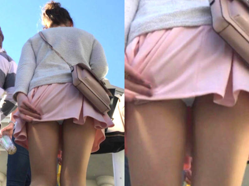 お尻側からスカート押さえるエロ画像